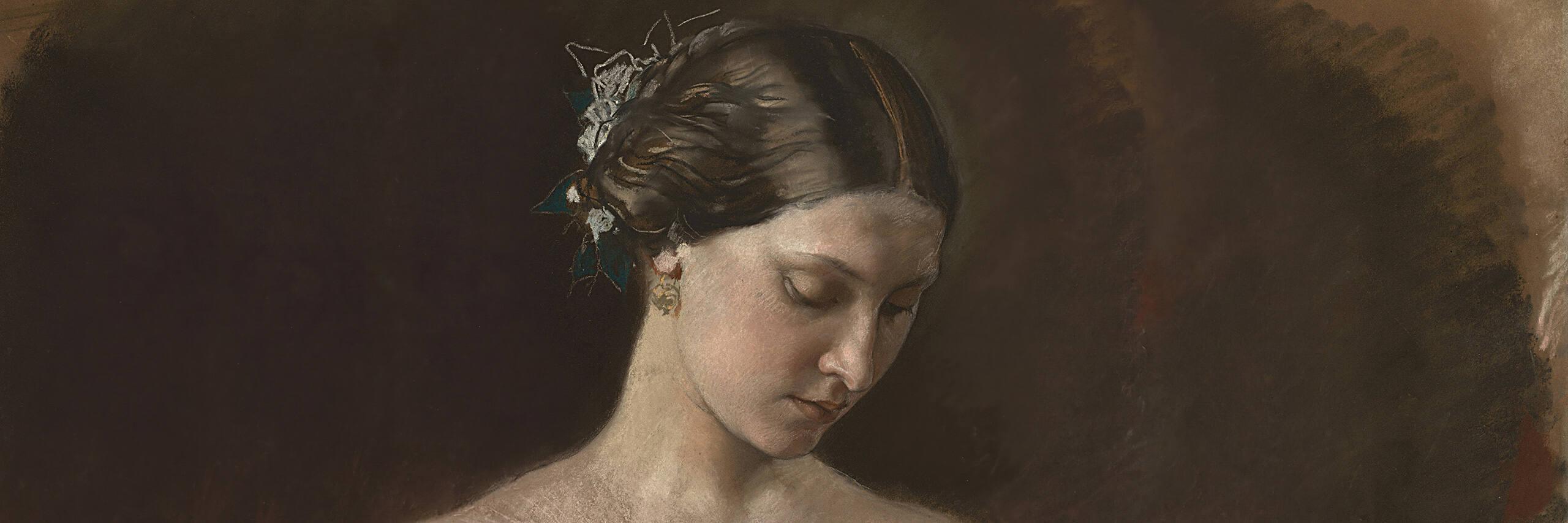 Portrait of a woman wearing antique style earrings representing vintage jewellery