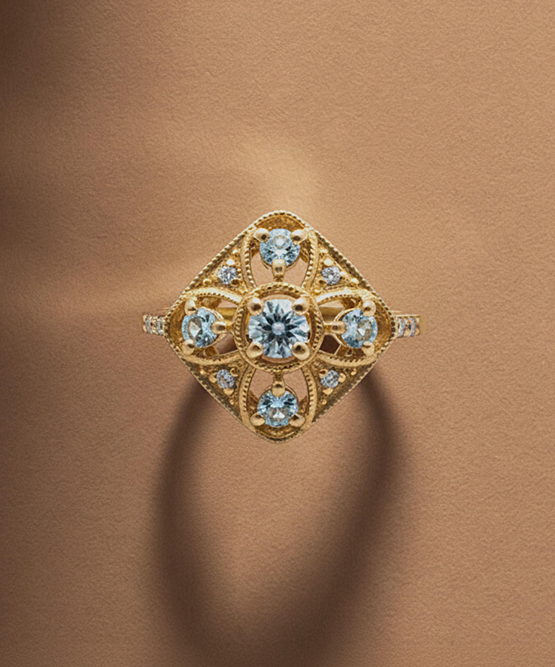 Art Deco inspired gold ring set with blue topaz gemstones, part of The Gemstone Edit vintage jewellery collection by Jenny Jones.